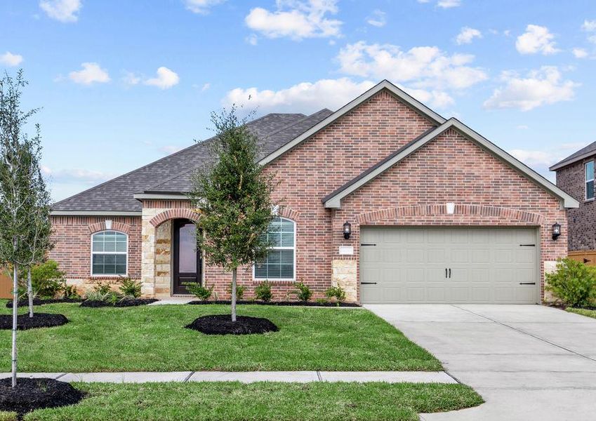 Beautiful single story home with brick and stone and front yard landscaping