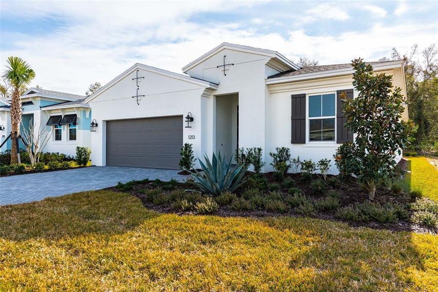 Front exterior of a new home in Cresswind DeLand, Deland, FL, highlighting curb appeal (Image 19).