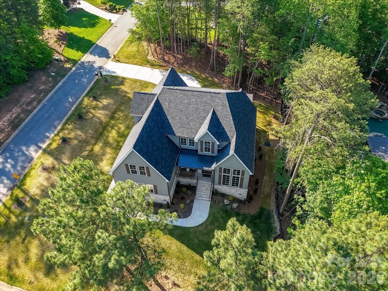 Stunning craftsman-style home with charming covered front porch, stone accents, and nestled on a private, wooded lot offering both curb appeal and peaceful surroundings. Stunning craftsman-style home with charming covered front porch, stone accents, and nestled on a private, wooded lot offering both curb appeal and peaceful surroundings.