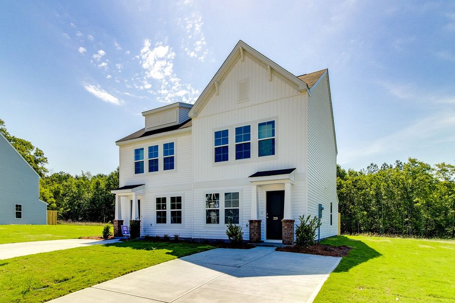 Front exterior of a new home in Padgett Commons, Hopkins, SC, highlighting curb appeal (Image 1). Front exterior of a new home in Padgett Commons, Hopkins, SC, highlighting curb appeal (Image 1).