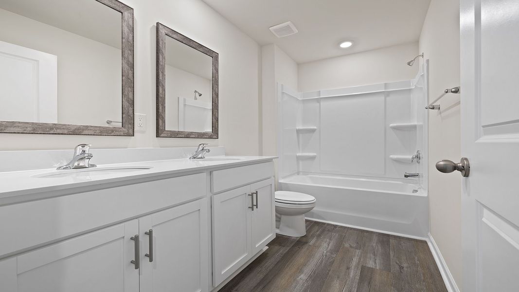 Furnished interior view inside a new home in Lakestone, Woodruff (Image 9).