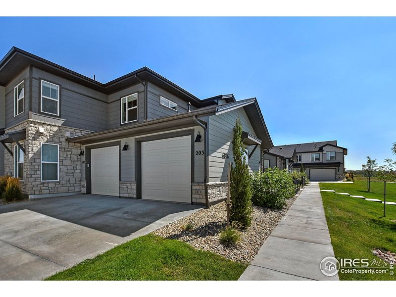 Front exterior of a new home in , Timnath, CO, highlighting curb appeal (Image 18).