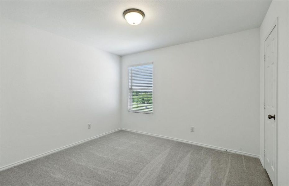 Spacious secondary bedroom with ample closet space *real home pictured