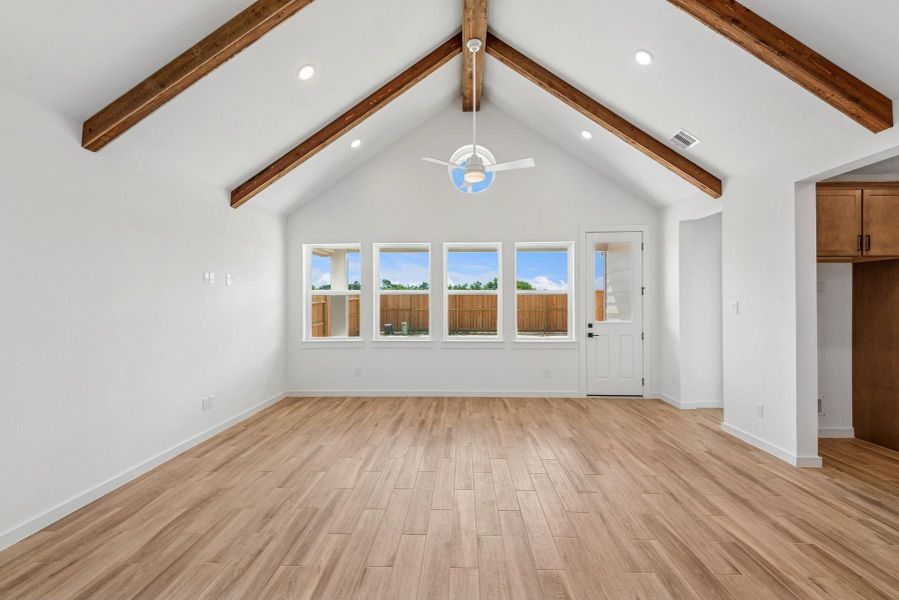 Impressive living area with high ceilings and stained beams