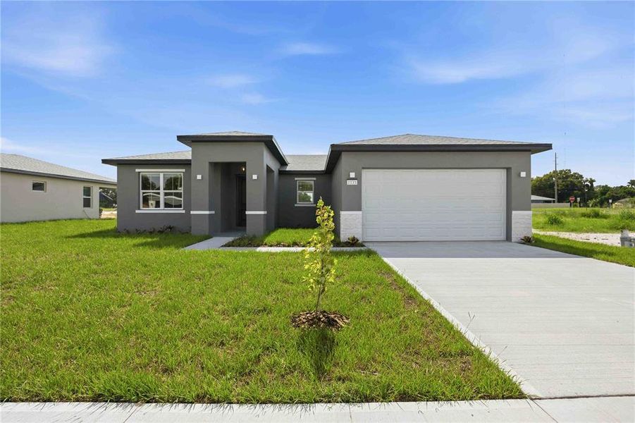 Front exterior of a new home in , Winter Haven, FL, highlighting curb appeal (Image 18). Front exterior of a new home in , Winter Haven, FL, highlighting curb appeal (Image 18).