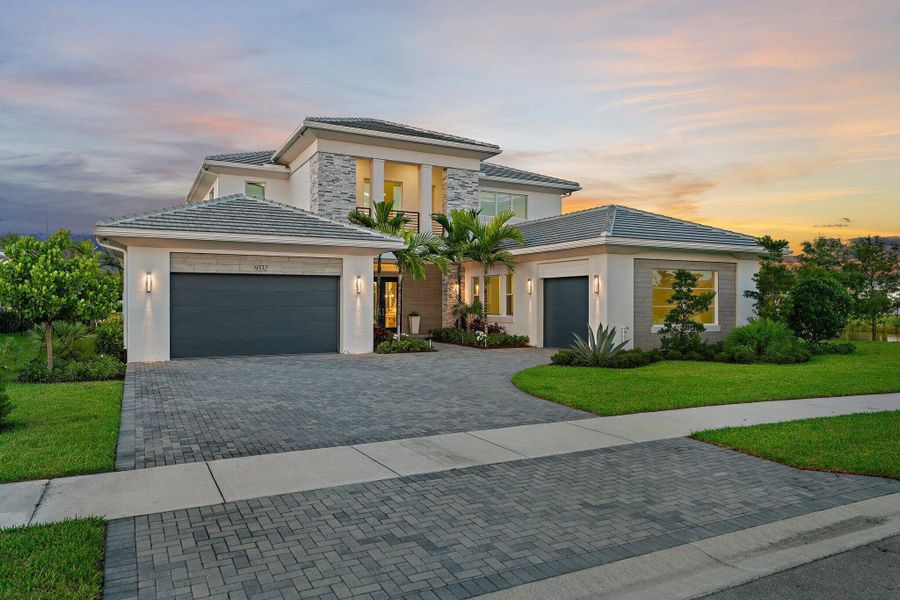 Front exterior of a new home in Coral Isles at Avenir, Palm Beach Gardens, FL, highlighting curb appeal (Image 19).