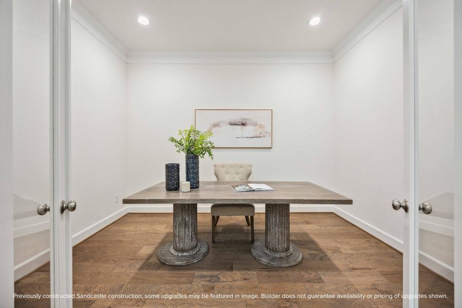 Need a quiet space to work or create? This glass-doored room near the entry is ideal for a study, Zoom room, or library—with just enough privacy to stay focused.