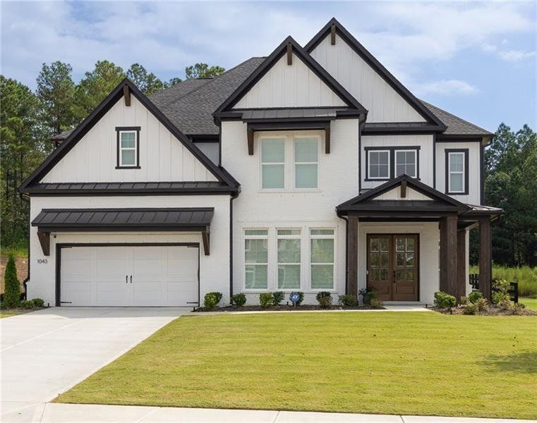 Front exterior of a new home in , Woodstock, GA, highlighting curb appeal (Image 25).