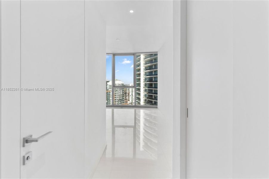 Spacious, unfurnished interior of a new home in Aston Martin Residences, Miami (Image 14).