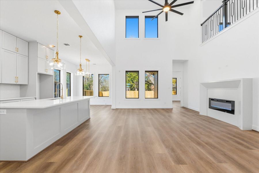 Beautiful picture windows surround the open-concept great room, filling the space with natural light and allowing for easy everyday living and weekend entertaining.