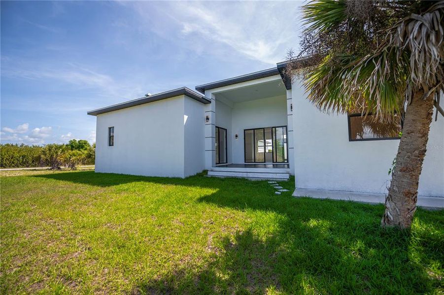 Exterior details and patio area of a home in , Port Charlotte (Image 36).