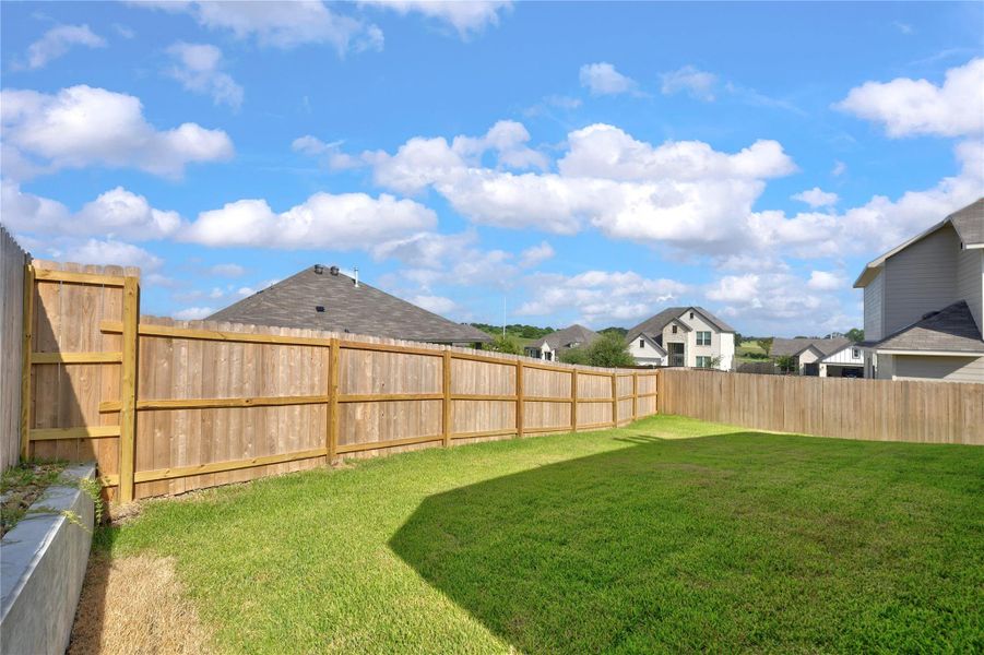 Exterior details and patio area of a home in Vintage Farms, Brenham (Image 31).