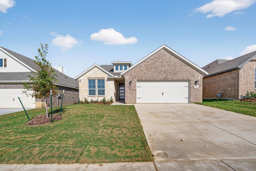 Front exterior of a new home in Liberty Pointe, Gainesville, TX, highlighting curb appeal (Image 2). Front exterior of a new home in Liberty Pointe, Gainesville, TX, highlighting curb appeal (Image 2).