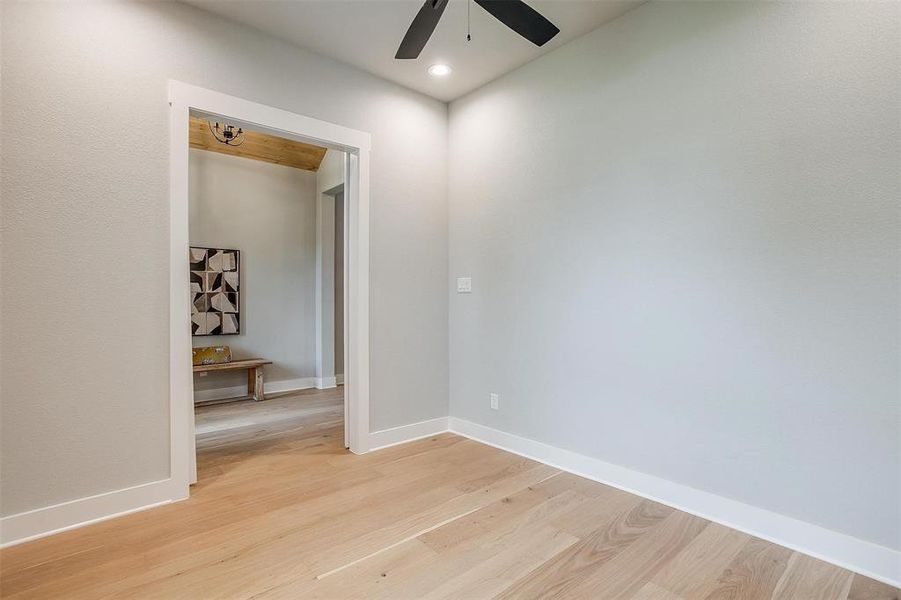 Spare room with recessed lighting, light wood-style flooring, a ceiling fan, and baseboards Spare room with recessed lighting, light wood-style flooring, a ceiling fan, and baseboards
