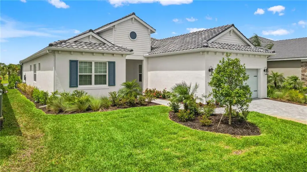 Front exterior of a new home in , Sarasota, FL, highlighting curb appeal (Image 2). Front exterior of a new home in , Sarasota, FL, highlighting curb appeal (Image 2).