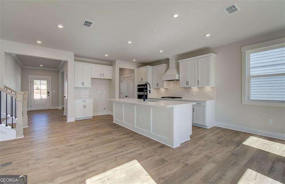 Furnished interior view inside a new home in The Paddocks at Doc Hughes, Buford (Image 5).