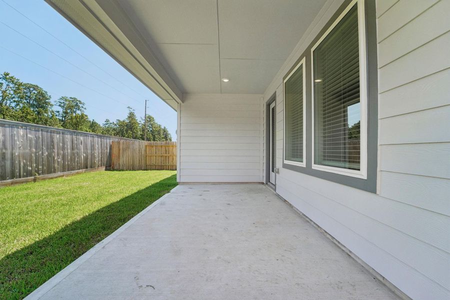 Exterior details and patio area of a home in Granger Pointe - Traditional Series, Conroe (Image 2). Exterior details and patio area of a home in Granger Pointe - Traditional Series, Conroe (Image 2).