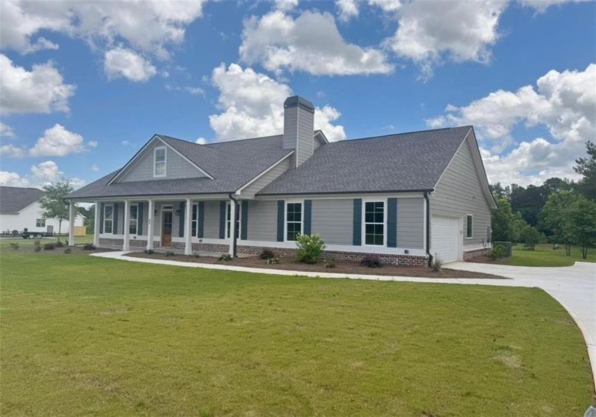 Front exterior of a new home in , Social Circle, GA, highlighting curb appeal (Image 1). Front exterior of a new home in , Social Circle, GA, highlighting curb appeal (Image 1).
