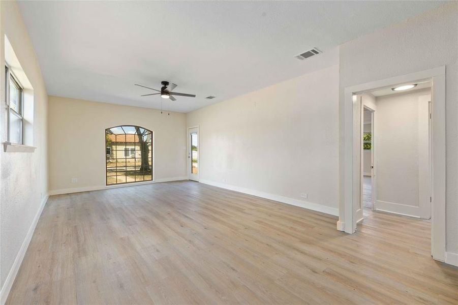 Spare room with light wood-style flooring and ceiling fan Spare room with light wood-style flooring and ceiling fan