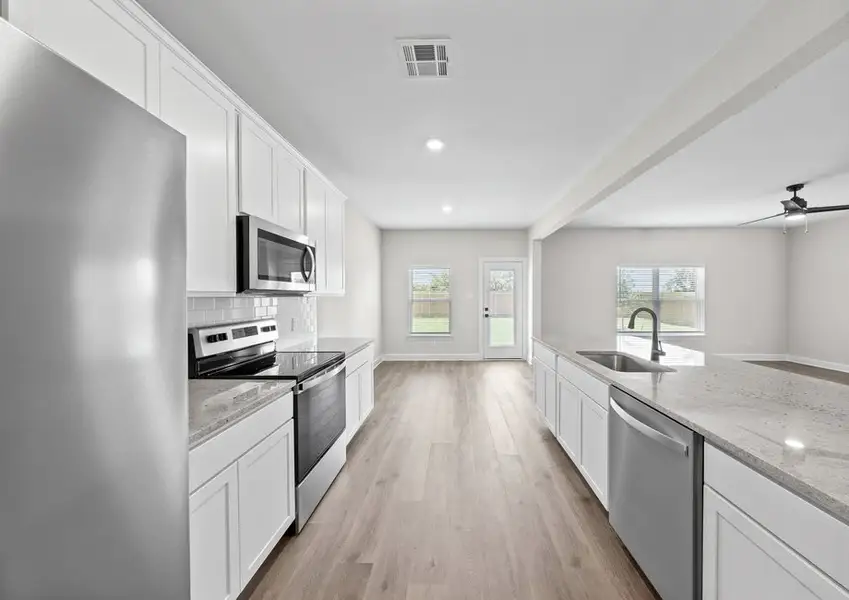 The kitchen of the Cypress has gorgeous white good cabinetry. The kitchen of the Cypress has gorgeous white good cabinetry.