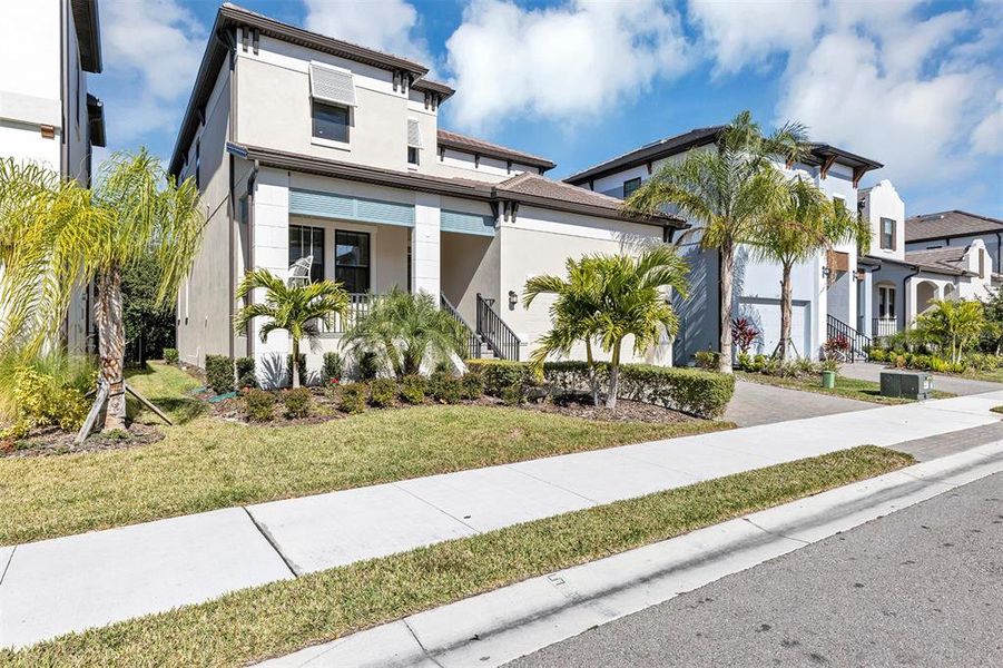 Front exterior of a new home in SouthShore Yacht Club: Somerset Preserve, Ruskin, FL, highlighting curb appeal (Image 2). Front exterior of a new home in SouthShore Yacht Club: Somerset Preserve, Ruskin, FL, highlighting curb appeal (Image 2).