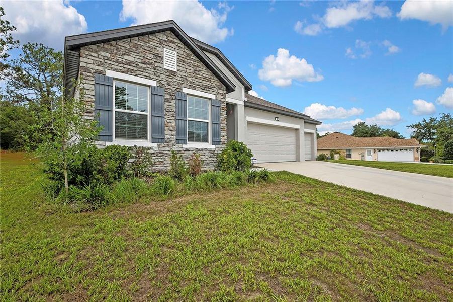 Front exterior of a new home in , Homosassa, FL, highlighting curb appeal (Image 2). Front exterior of a new home in , Homosassa, FL, highlighting curb appeal (Image 2).