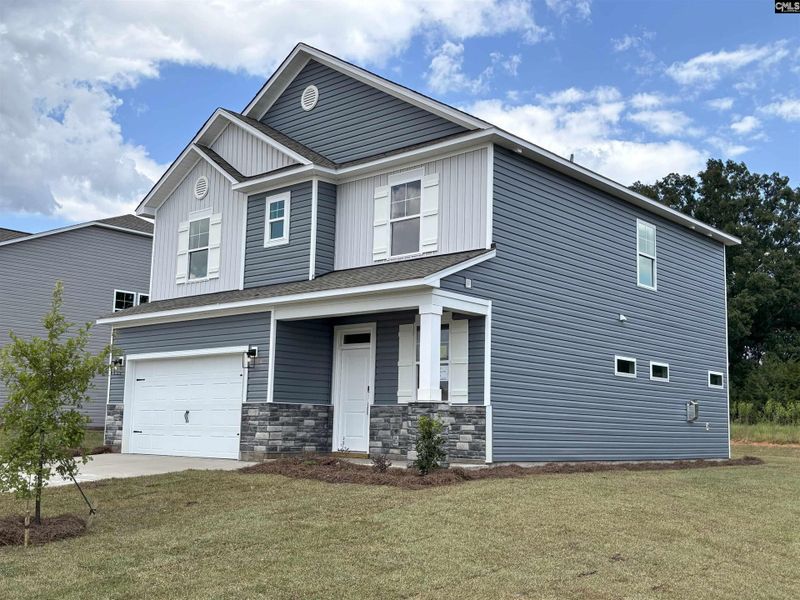 Front exterior of a new home in Rolling Hills, Prosperity, SC, highlighting curb appeal (Image 3).