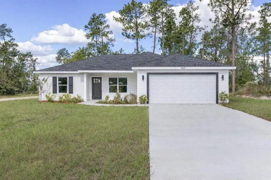Front exterior of a new home in , Ocala, FL, highlighting curb appeal (Image 1). Front exterior of a new home in , Ocala, FL, highlighting curb appeal (Image 1).