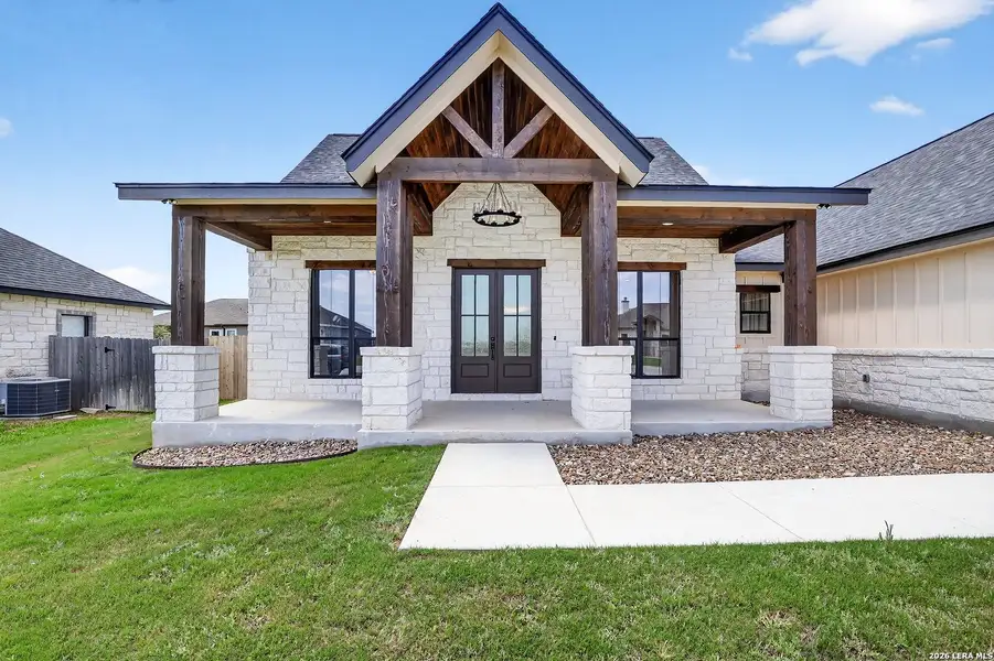 Exterior details and patio area of a home in , Poth (Image 3).