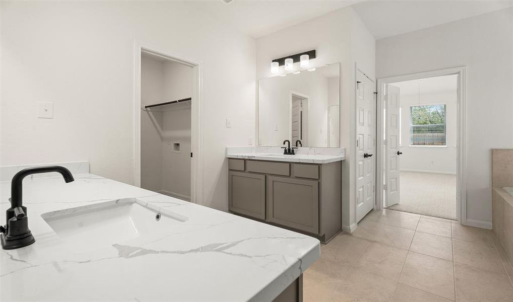 Dual vanity sinks in owner's bath (*Photo not of actual home and used for illustration purposes only.)