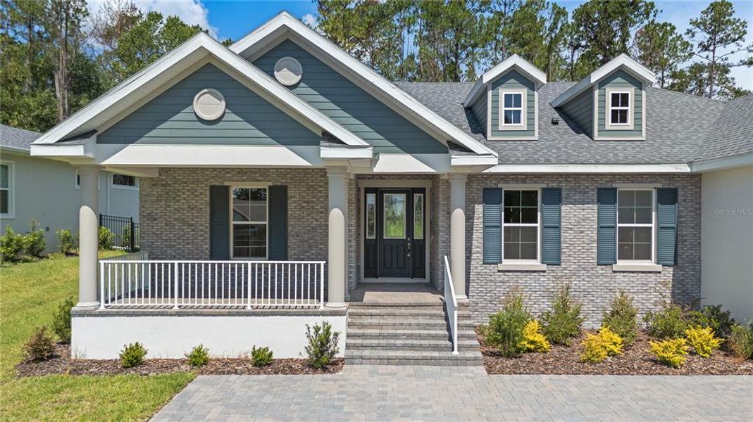 Front exterior of a new home in Southern Hills Plantation, Brooksville, FL, highlighting curb appeal (Image 24). Front exterior of a new home in Southern Hills Plantation, Brooksville, FL, highlighting curb appeal (Image 24).
