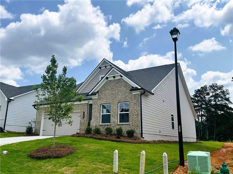 Front exterior of a new home in Summerlin, Winder, GA, highlighting curb appeal (Image 20).