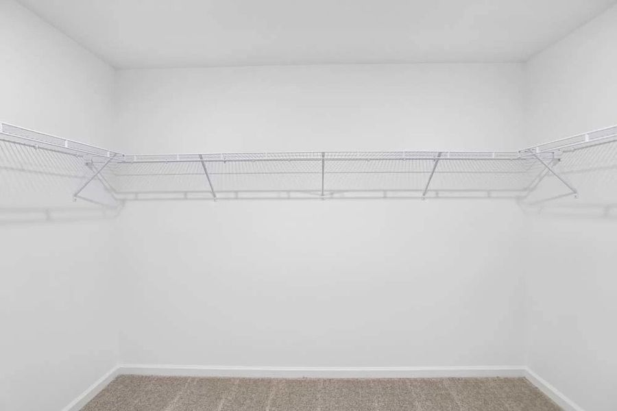 Sample Photo: Primary Bedroom Walk-In Closet Sample Photo: Primary Bedroom Walk-In Closet