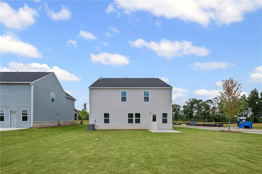 Front exterior of a new home in Hawthorne Ridge, McDonough, GA, highlighting curb appeal (Image 18). Front exterior of a new home in Hawthorne Ridge, McDonough, GA, highlighting curb appeal (Image 18).