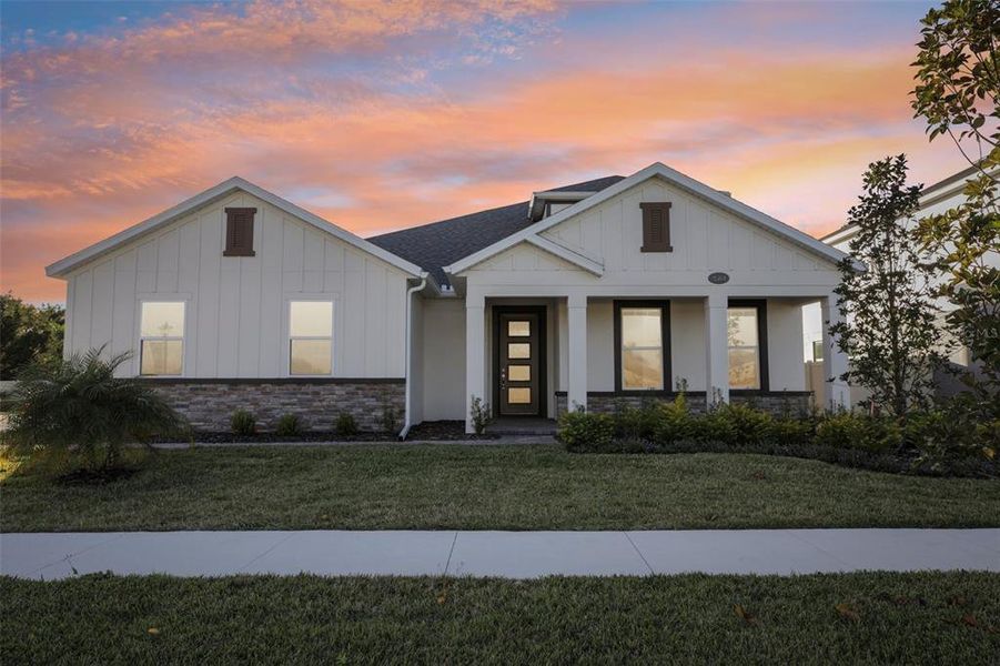 Front exterior of a new home in Hawk's Overlook, Oviedo, FL, highlighting curb appeal (Image 24).