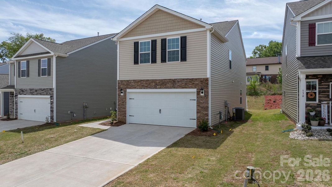 Front exterior of a new home in The Hamptons at Hickory, Hickory, NC, highlighting curb appeal (Image 21).