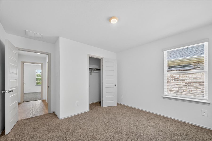 The three secondary bedrooms are located at the front of the home, with a full bath conveniently situated between them. As a 2023 build, the home includes double-pane, energy-efficient windows and other modern features designed for comfort and savings. The three secondary bedrooms are located at the front of the home, with a full bath conveniently situated between them. As a 2023 build, the home includes double-pane, energy-efficient windows and other modern features designed for comfort and savings.