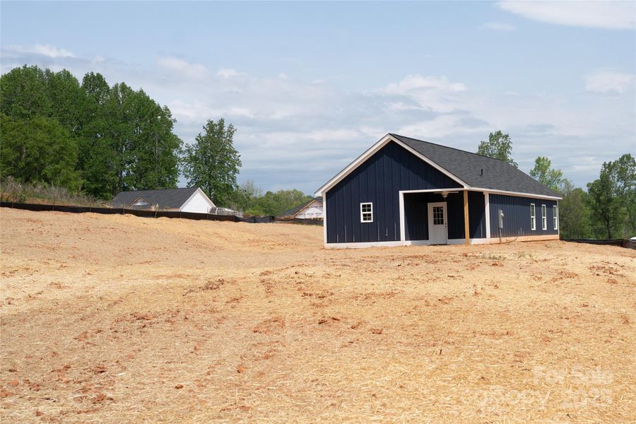 Front exterior of a new home in , Clover, SC, highlighting curb appeal (Image 22).