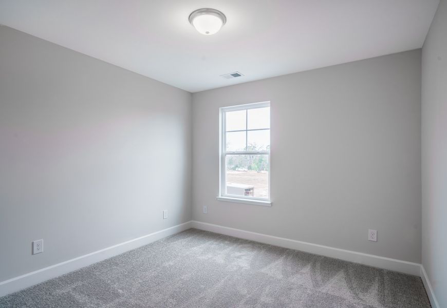 Representative unfurnished interior of a home built from the The McKee Manor by Cothran Homes in Holly Ridge, Greenville (Image 37). Representative unfurnished interior of a home built from the The McKee Manor by Cothran Homes in Holly Ridge, Greenville (Image 37).