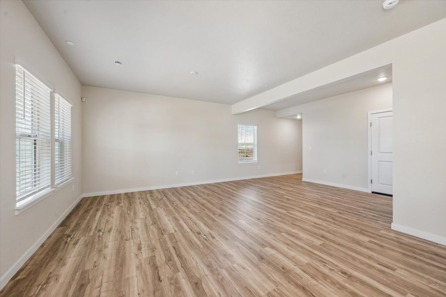 A room with a wood floor and a wood floor.