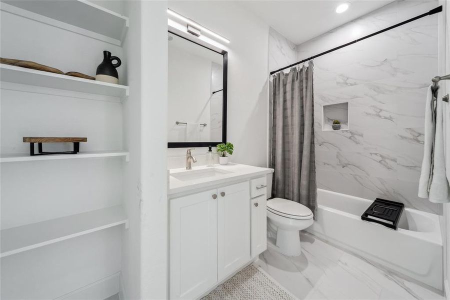 Full bathroom (2nd floor) with shower / tub combo with curtain, vanity, and toilet