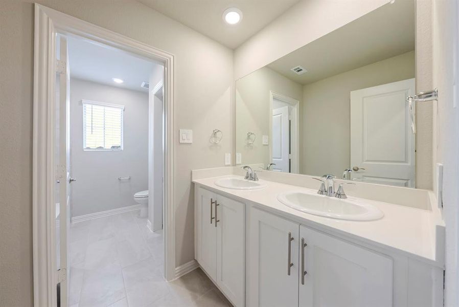Full bathroom featuring double vanity and recessed lighting Full bathroom featuring double vanity and recessed lighting