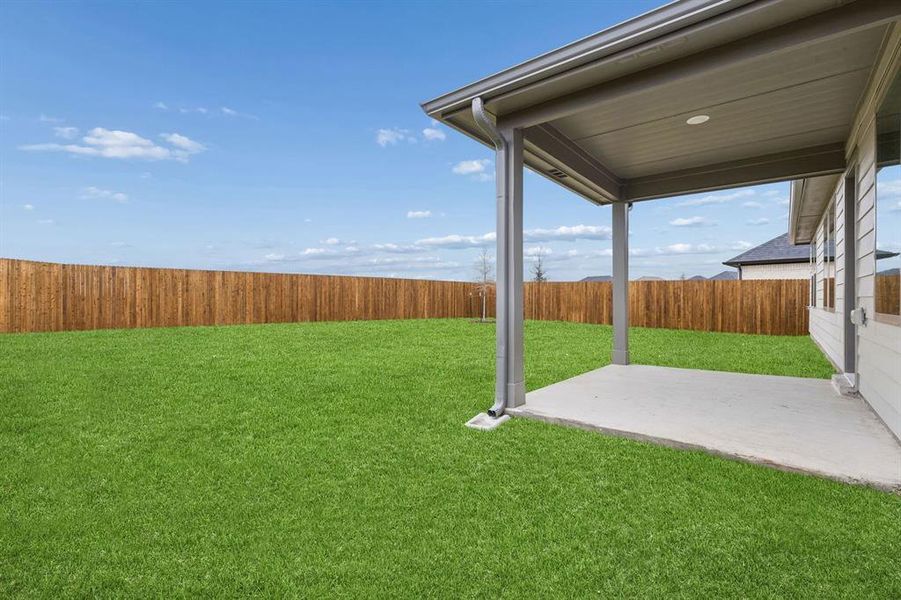 Covered Patio in the Emmy II home plan by Trophy Signature Homes - REPRESENTATIVE PHOTO