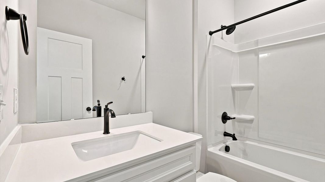 Stylish guest bathroom with superior design and thoughtful storage solutions Stylish guest bathroom with superior design and thoughtful storage solutions
