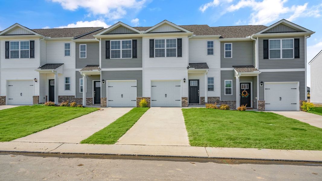 Front exterior of a new home in The Townes at Prestleigh, Wake Forest, NC, highlighting curb appeal (Image 1). Front exterior of a new home in The Townes at Prestleigh, Wake Forest, NC, highlighting curb appeal (Image 1).