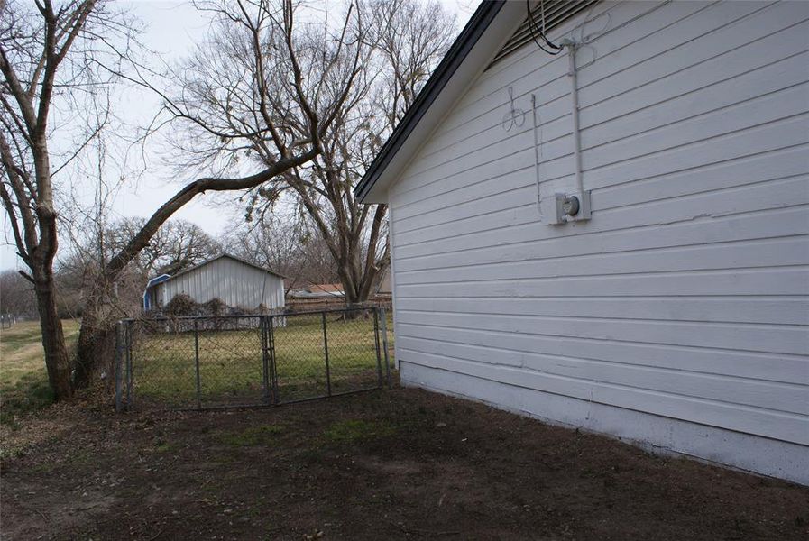 Double entry gate to completely fenced back yard.