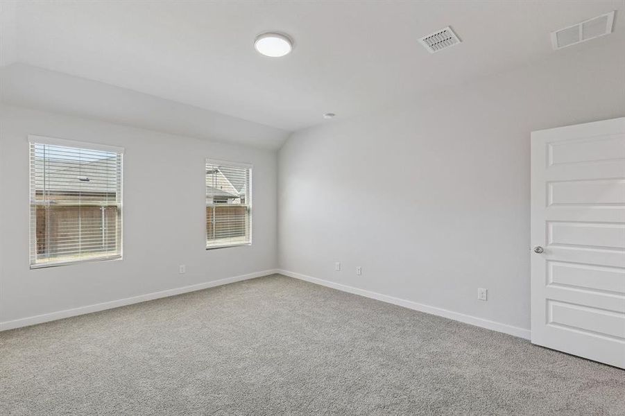 Primary Suite in the Harrison home plan by Trophy Signature Homes – REPRESENTATIVE PHOTO