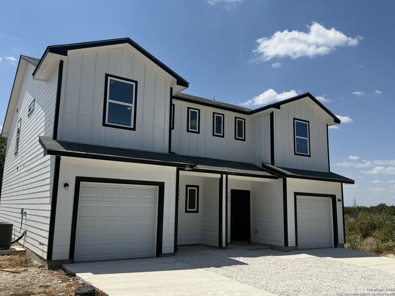 Front exterior of a new home in , San Antonio, TX, highlighting curb appeal (Image 1).