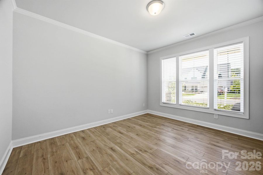 Dedicated office at the front of the house with glass French doors.