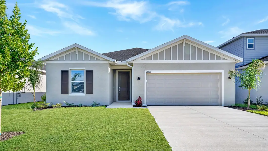 Front exterior of a new home in Willow, Punta Gorda, FL, highlighting curb appeal (Image 1). Front exterior of a new home in Willow, Punta Gorda, FL, highlighting curb appeal (Image 1).